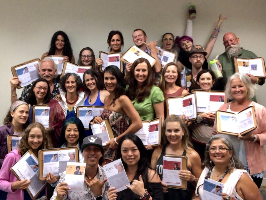Color Code workshop students with their completed workbooks